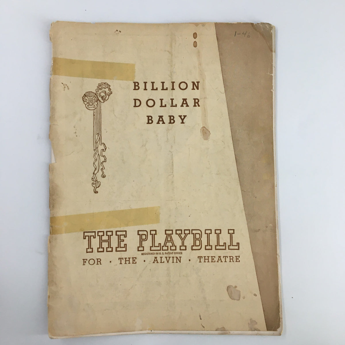 1946 Playbill for 'Billion Dollar Baby' at the Alvin Theatre, featuring notable wear and tear including tape and creases, highlighting its vintage appeal.