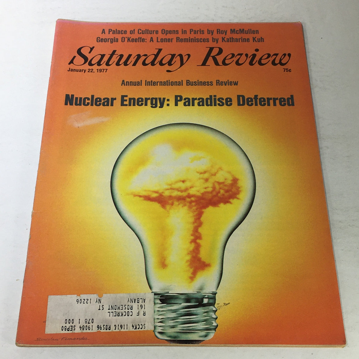 Cover of VTG Saturday Review: January 22 1977 - A Loner Reminisces by Katherine Kuh, featuring an illustration of a light bulb with a nuclear explosion design, and the title 'Nuclear Energy: Paradise Deferred' prominently displayed.