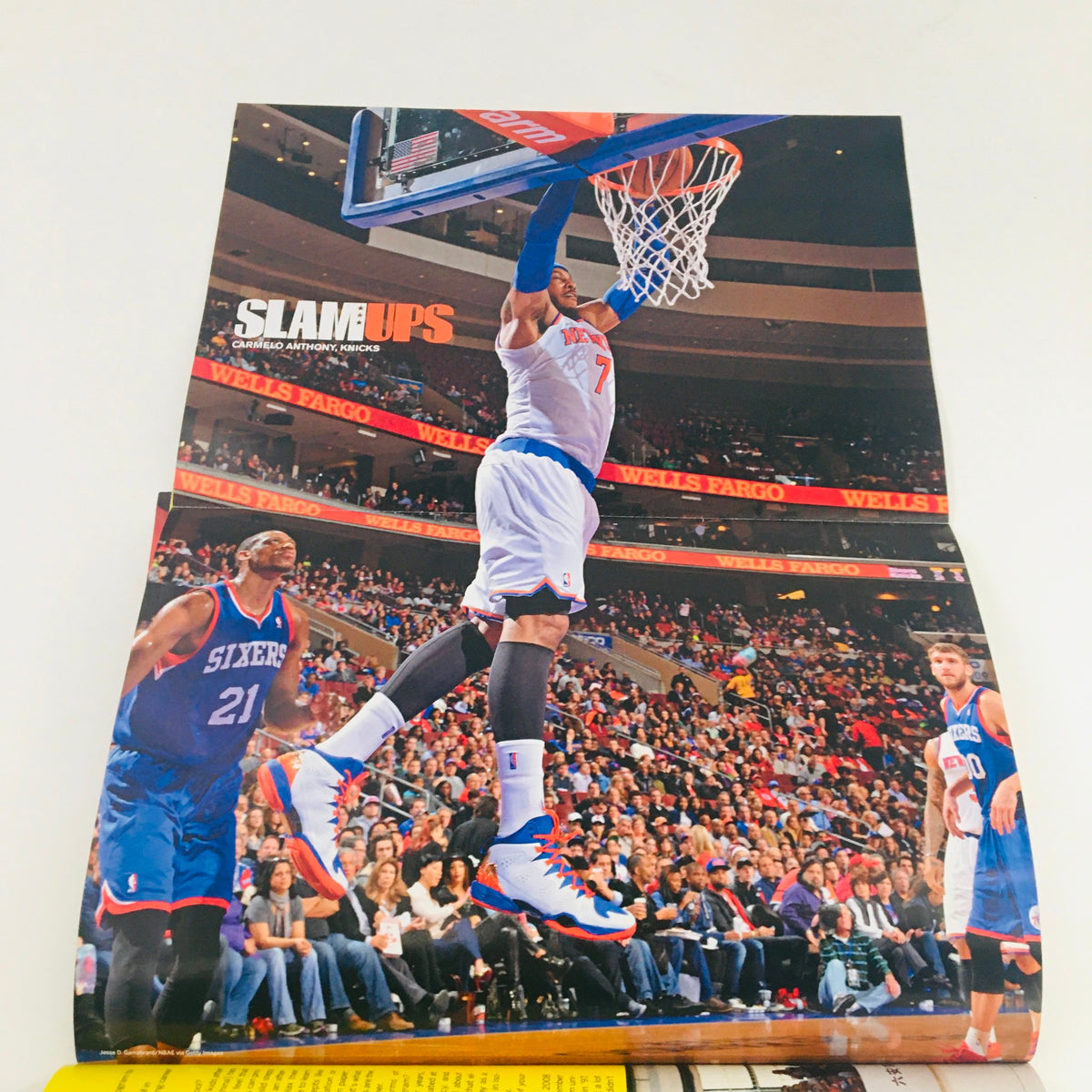 Inside Slam Magazine April 2014 #176, a poster of Carmelo Anthony in action during a game, demonstrating dynamic play in the NBA.