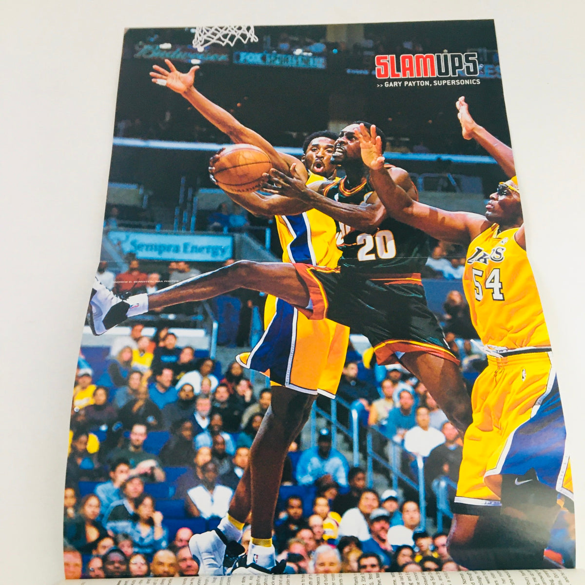 Slam Magazine February 2001 featuring Brooklyn Nets' Stephon Marbury, includes a poster highlighting Gary Payton making a play on the court against the Lakers.