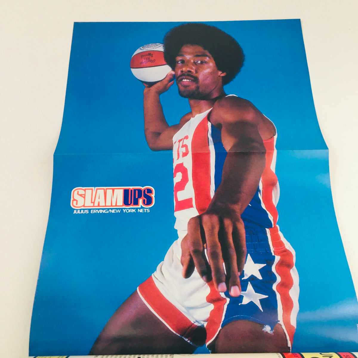 Vintage poster from Slam Magazine March 1999 featuring basketball legend Julius Erving in a New Jersey Nets uniform, showcasing his iconic style and athleticism.