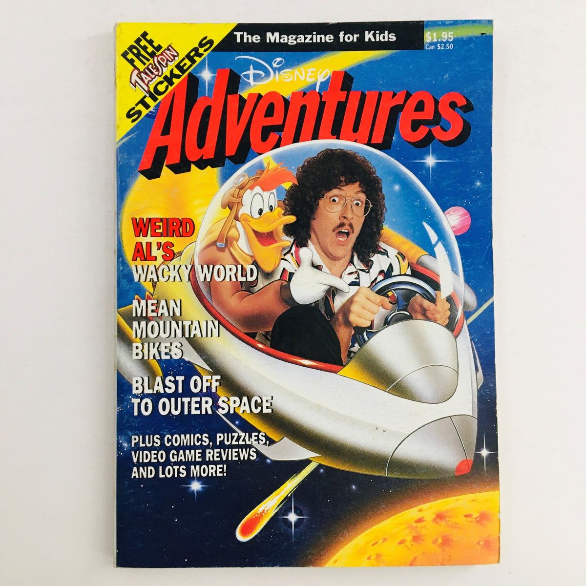 Cover of Disney Adventures Magazine April 1991 featuring Weird Al's Wacky World, showcasing vibrant illustrations of Weird Al and cartoon characters in a space theme. Perfect for collectors and fans of vintage Disney magazines.