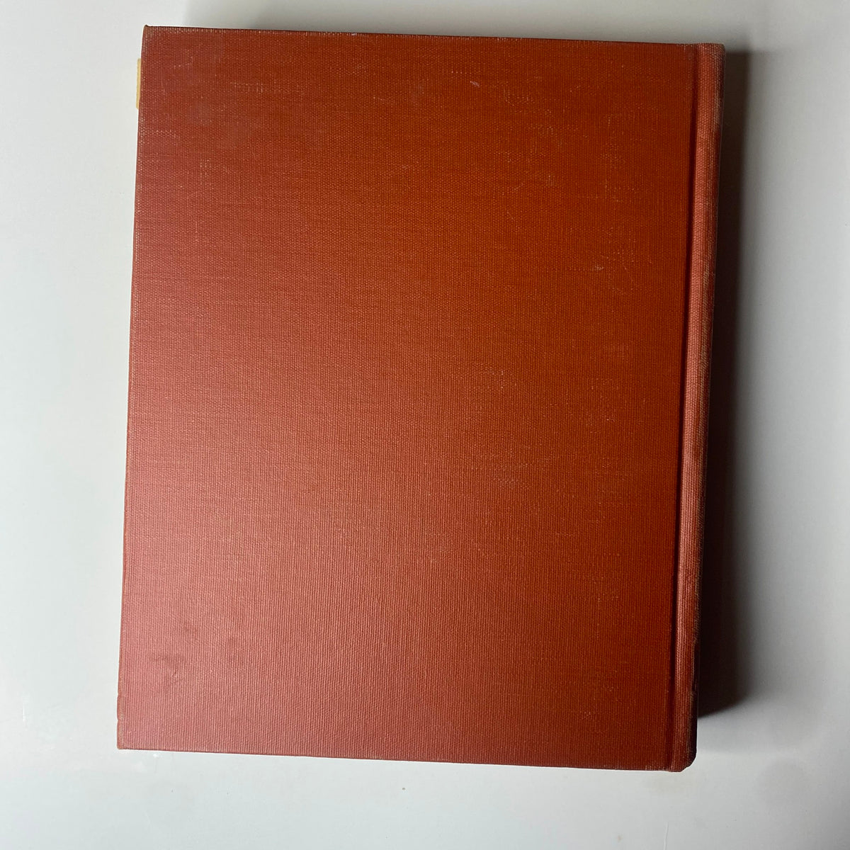 The back cover of The New York Times Library Edition Bound Magazine, presented in a simple red binding.