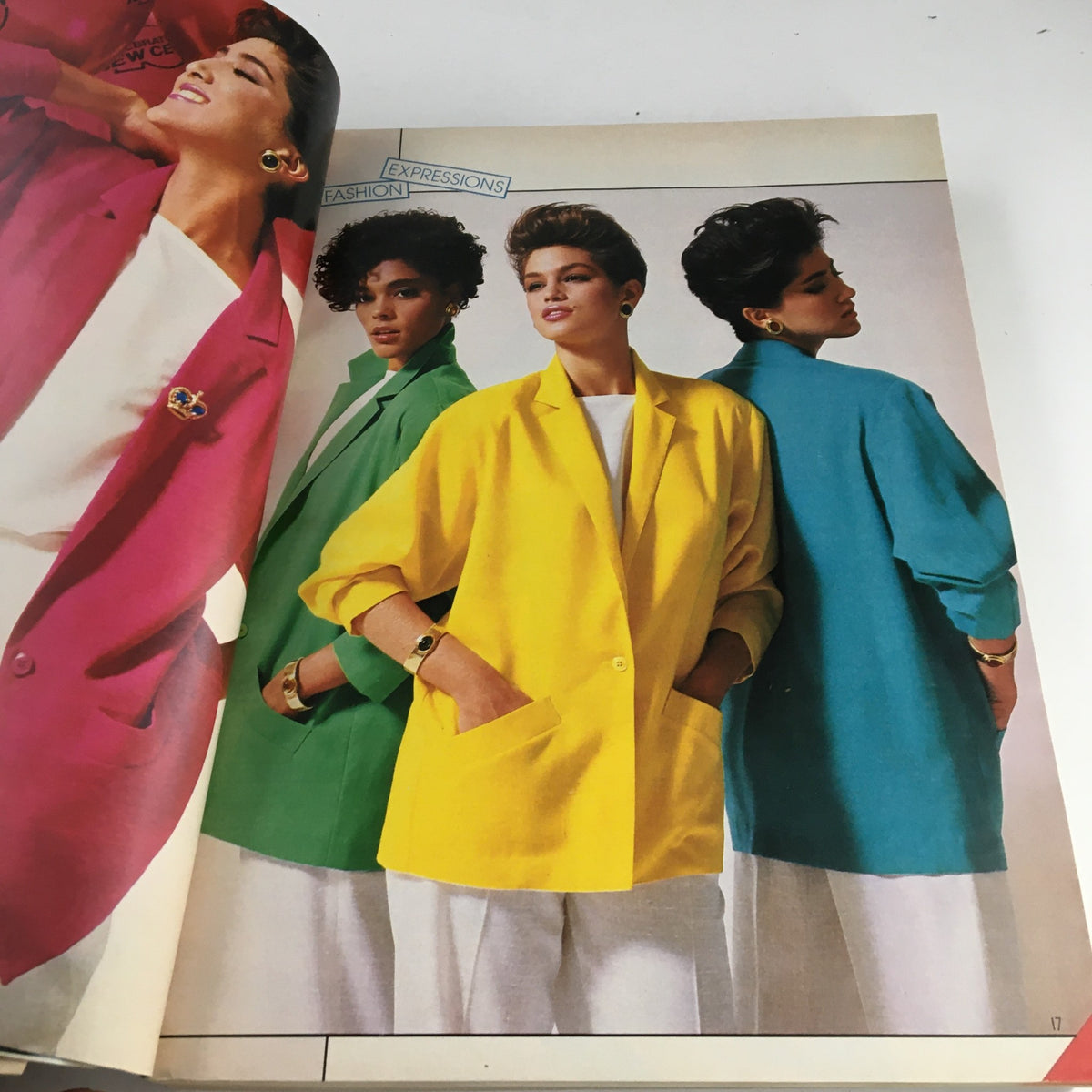 Fashion models showcasing vibrant jackets in red, green, yellow, and turquoise in the VTG 1986 Centennial Edition Fashion Apparel & Home Furnishing Catalog.