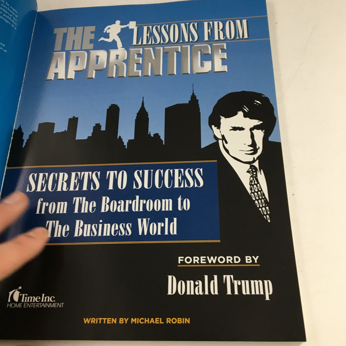 Title page of '2006 Lessons From The Apprentice: Secrets to Success' with foreword by Donald Trump and illustrations of the New York City skyline.