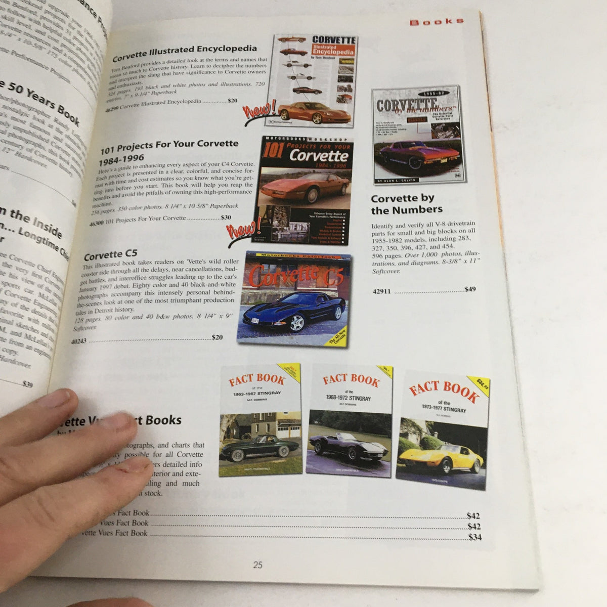 Page from the Corvette 1953-2005 Leather Jackets, Dash Cover, Accessories Catalog featuring books related to Corvette history and projects, including the Corvette Illustrated Encyclopedia.