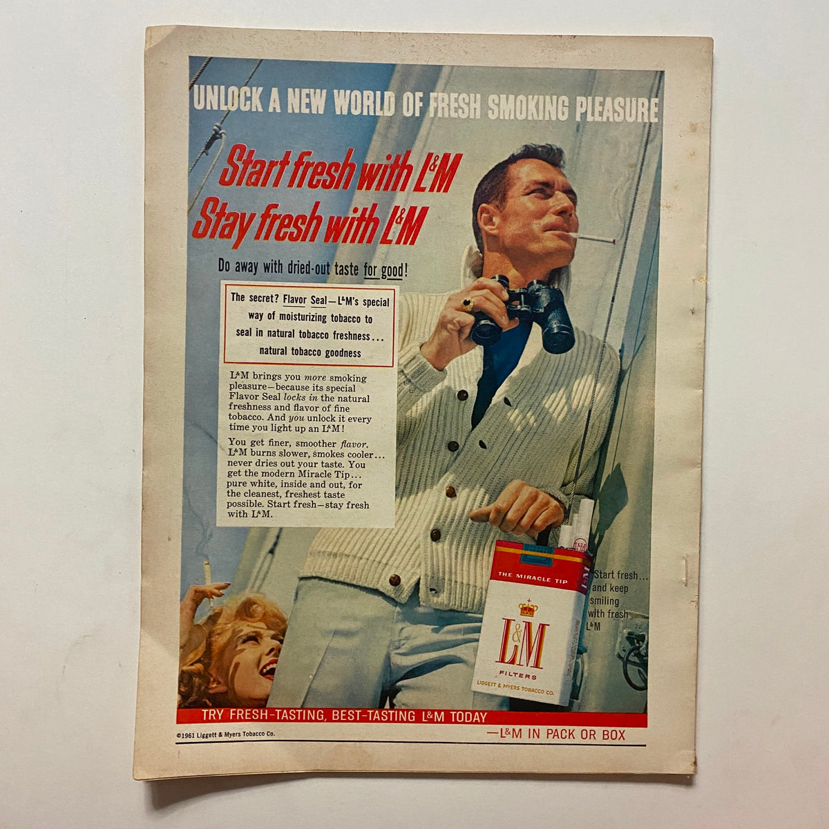 Vintage advertisement from VTG Motor Life Magazine August 1961 promoting L&M cigarettes, featuring a man smoking and highlighting the freshness of the product.