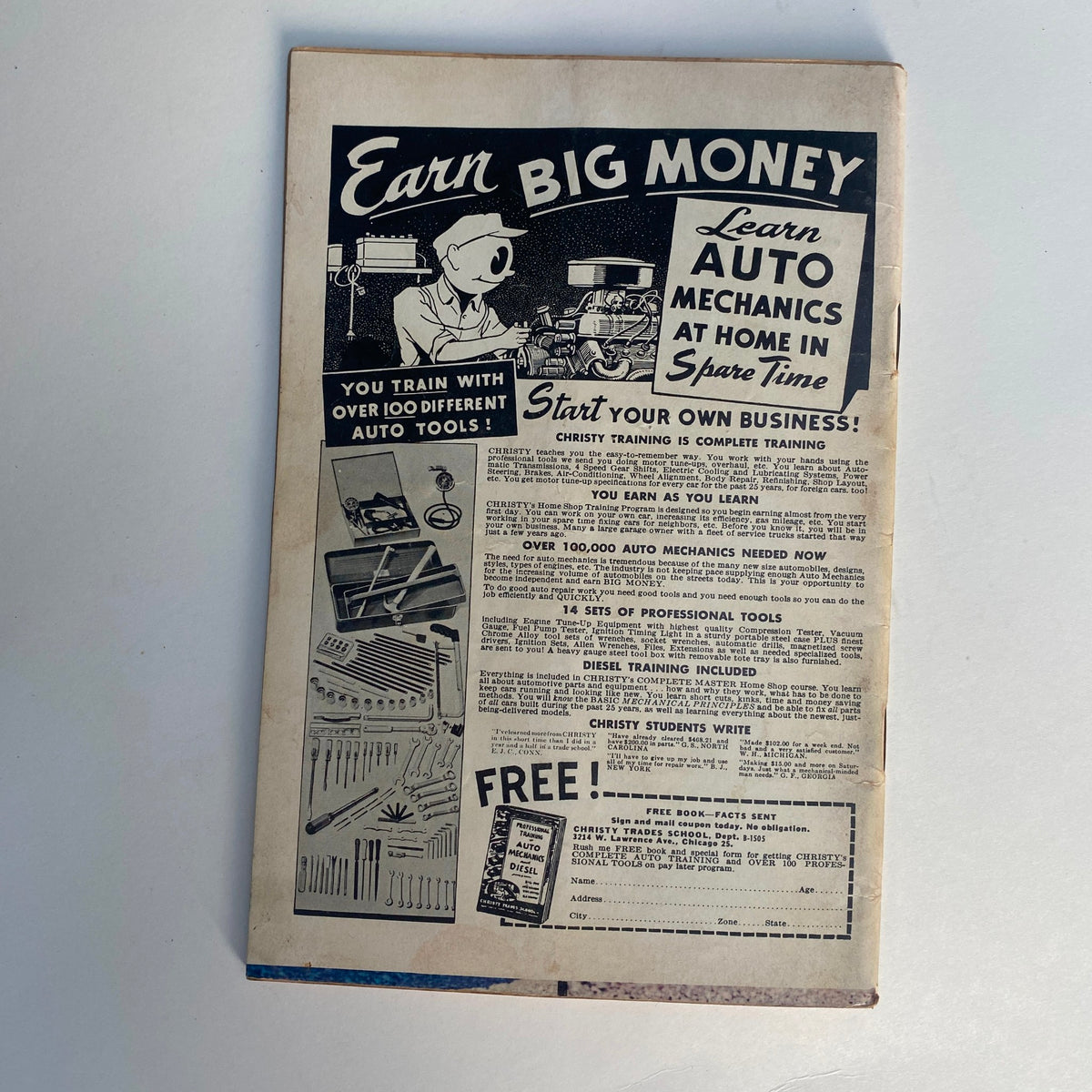 Back cover of VTG Rodding & Re-Styling Magazine June 1962 advertising auto mechanics training with a cartoon character and various auto tools.