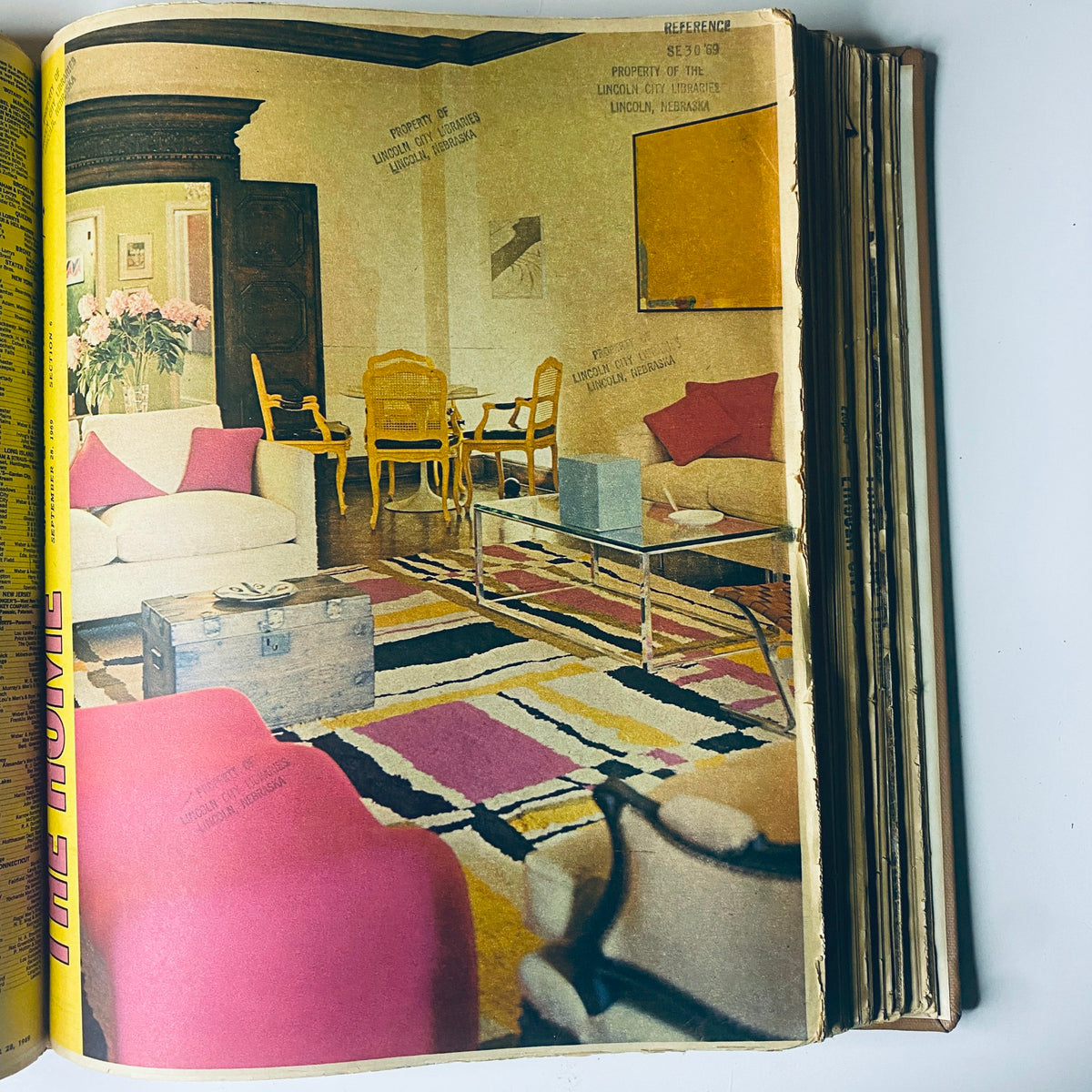 Interior design image from The New York Times Bound Magazine, showcasing a stylish living room with colorful furniture and decor, reflecting 1969 home trends.