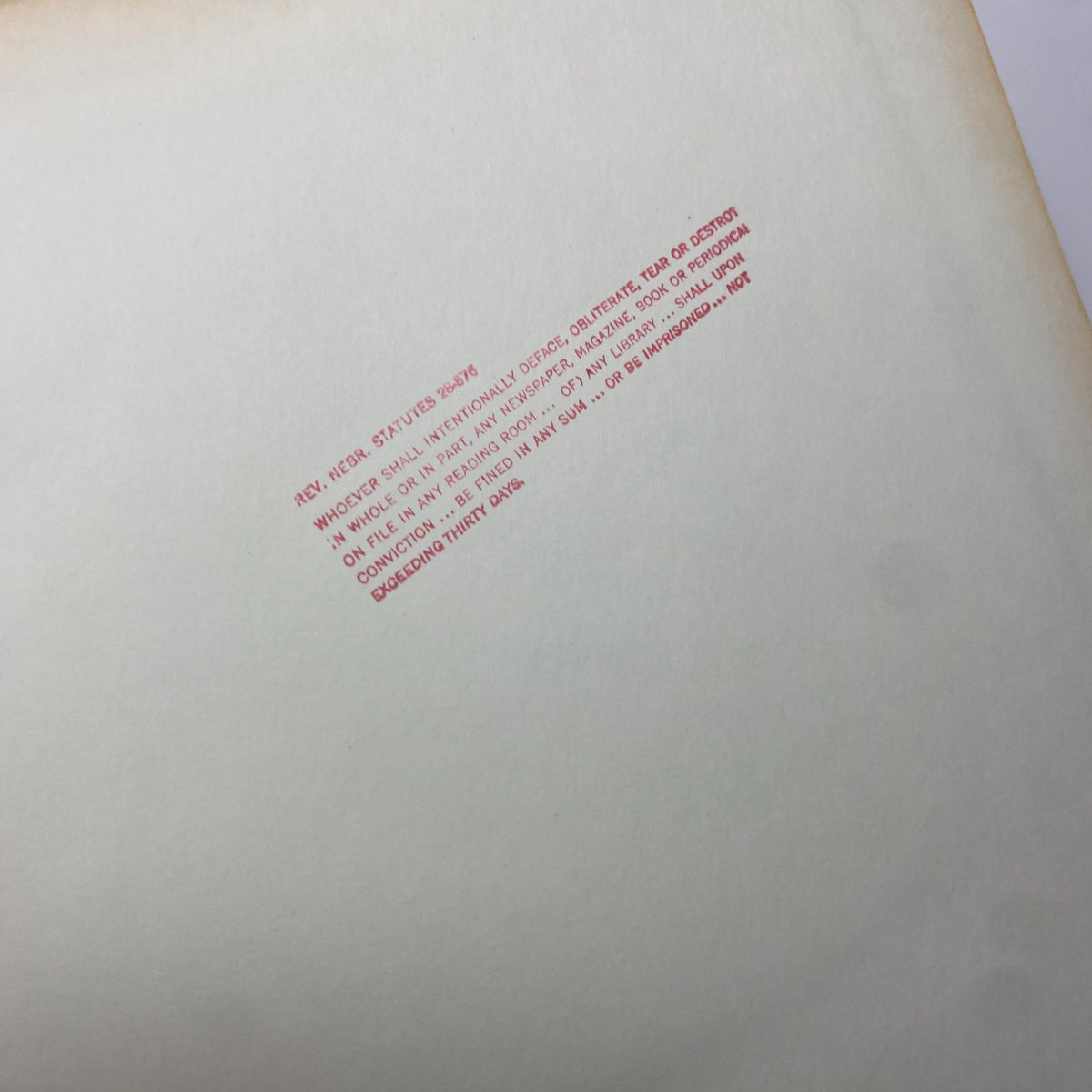 Inside page of The New York Times Library Edition Bound Magazine 1970 March - April with a red stamp warning against defacing materials, indicating library property.
