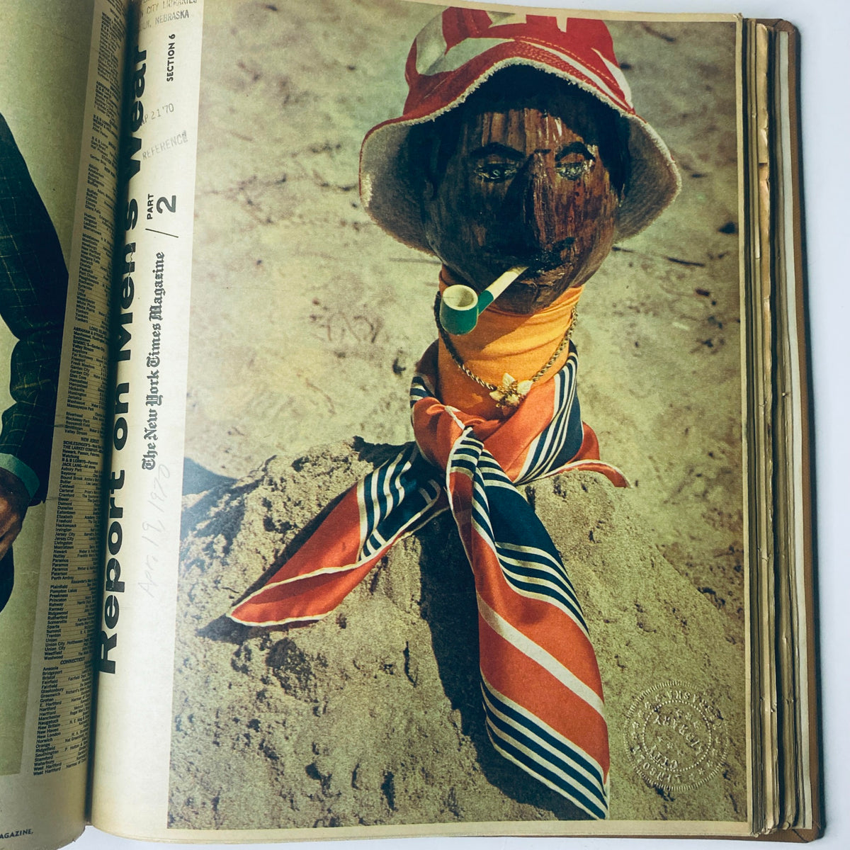 Image from The New York Times Library Edition Bound Magazine 1970 March - April showing a unique beach sculpture with a straw hat, scarf, and pipe, highlighting creative seaside art during that period.