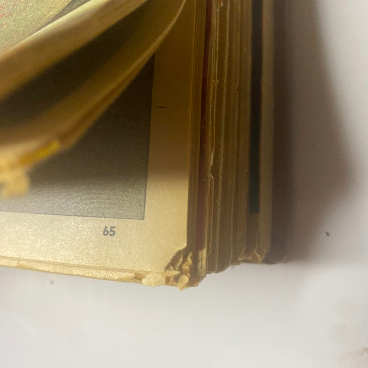 Close-up of the edges of the bound pages of The New York Times Magazine November-December 1971, highlighting their vintage quality.