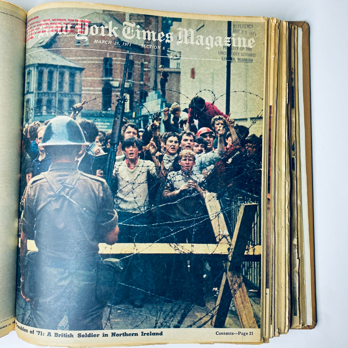 The New York Times Library Edition Bound Magazine 1971 March - April depicting a historical scene of a British soldier and a crowd in Northern Ireland during the 1970s.