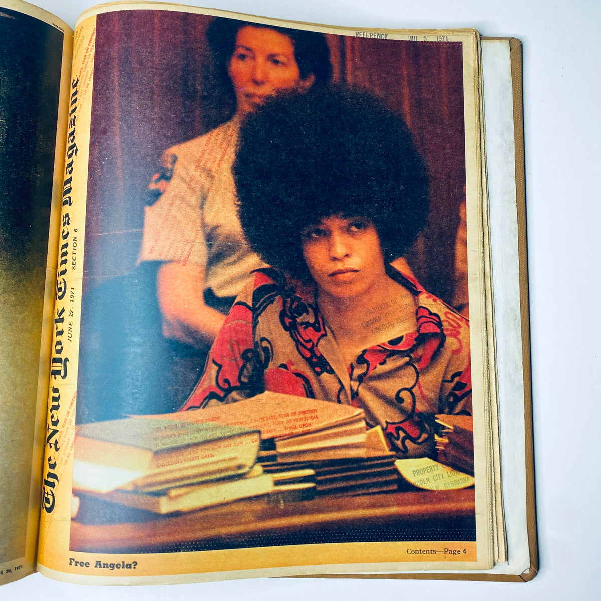 The New York Times Library Edition Bound Magazine 1971 May - June featuring an image of a young individual in a colorful shirt with an afro hairstyle, captured during a court session, highlighting themes of social justice and historical significance.