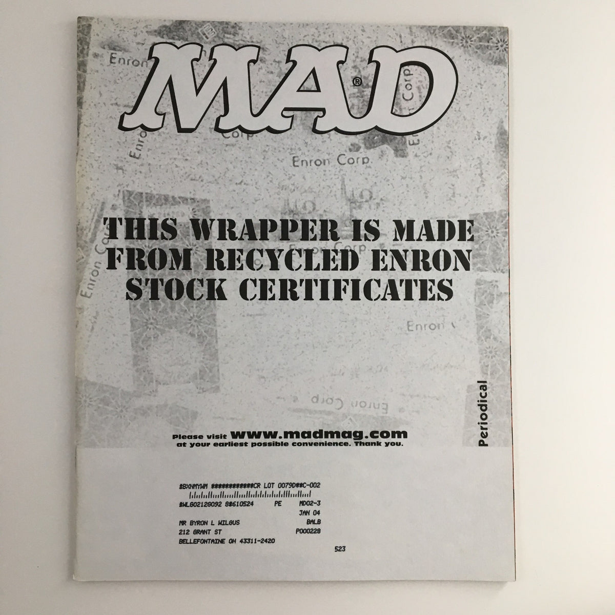 Back cover of Mad Magazine February 2003 #426, displaying a unique message stating that the wrapper is made from recycled Enron stock certificates, highlighting the magazine's quirky humor.