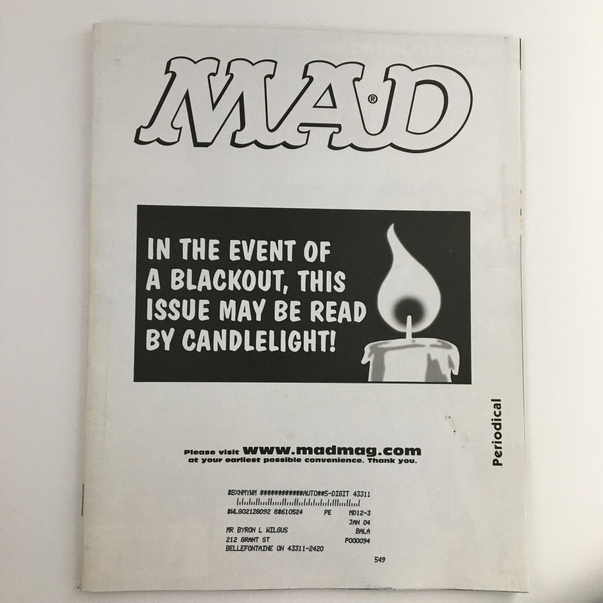 Back cover of Mad Magazine December 2003 #436 with text stating 'In the event of a blackout, this issue may be read by candlelight', emphasizing its status as a collectible vintage magazine.
