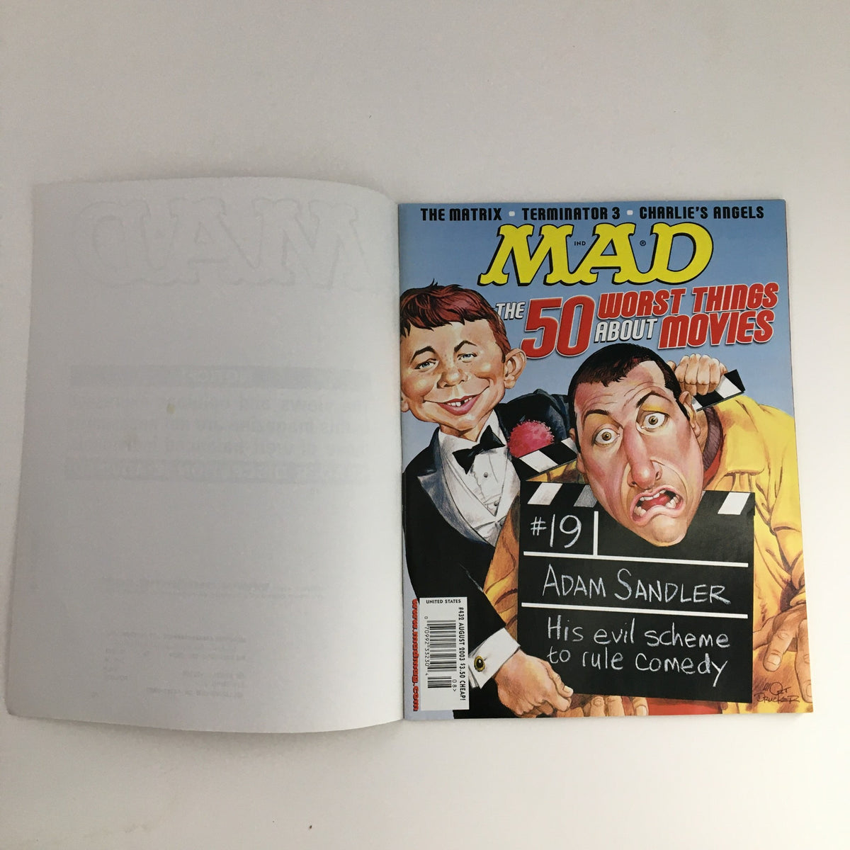 Mad Magazine August 2003 Issue #432 featuring Adam Sandler on the cover, highlighting the theme 'The 50 Worst Things About Movies'. The cover art showcases a humorous illustration, capturing the comedic essence of the magazine.
