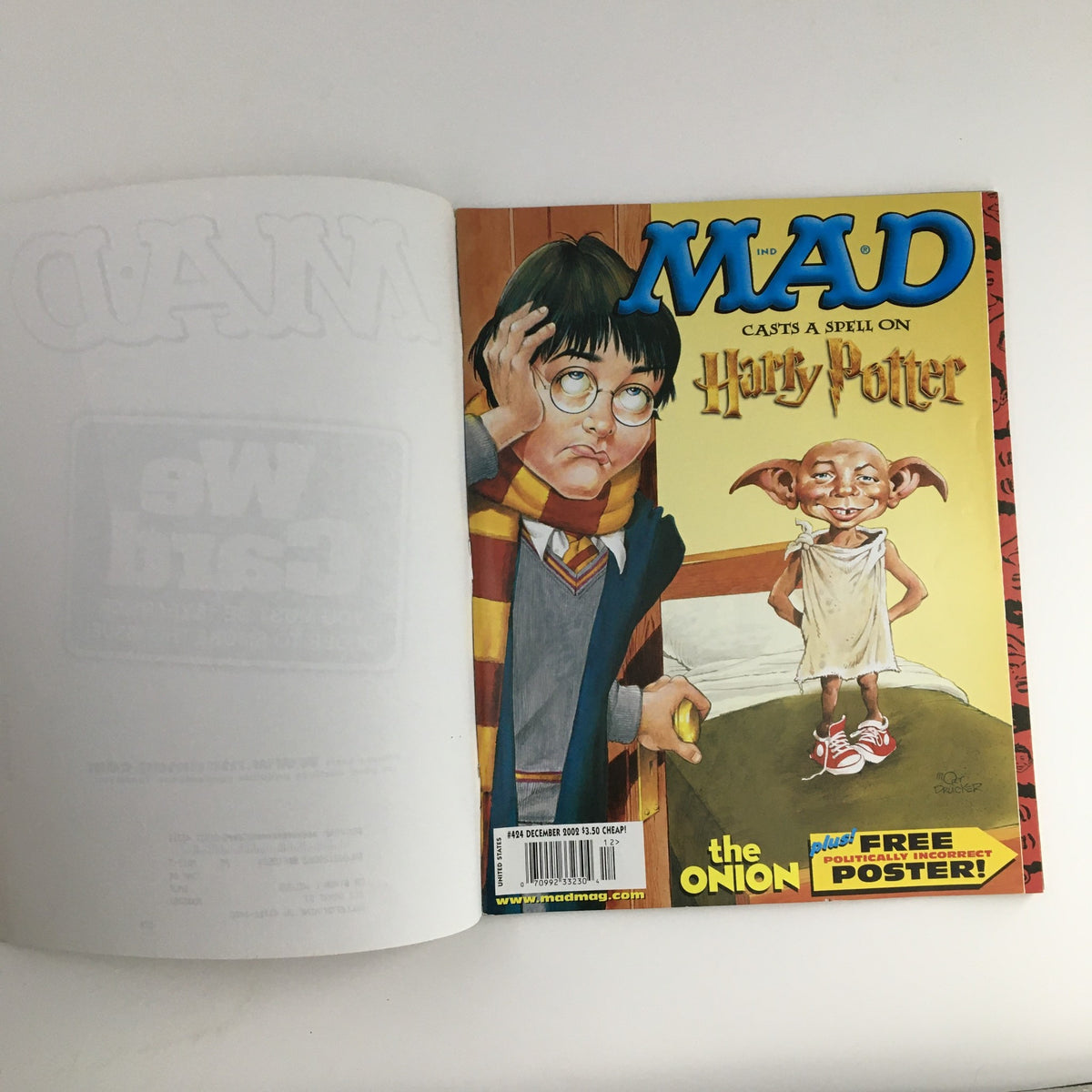 Mad Magazine December 2002 #424 Cover featuring a playful illustration of Harry Potter, showcasing the magazine's signature humor and satire.