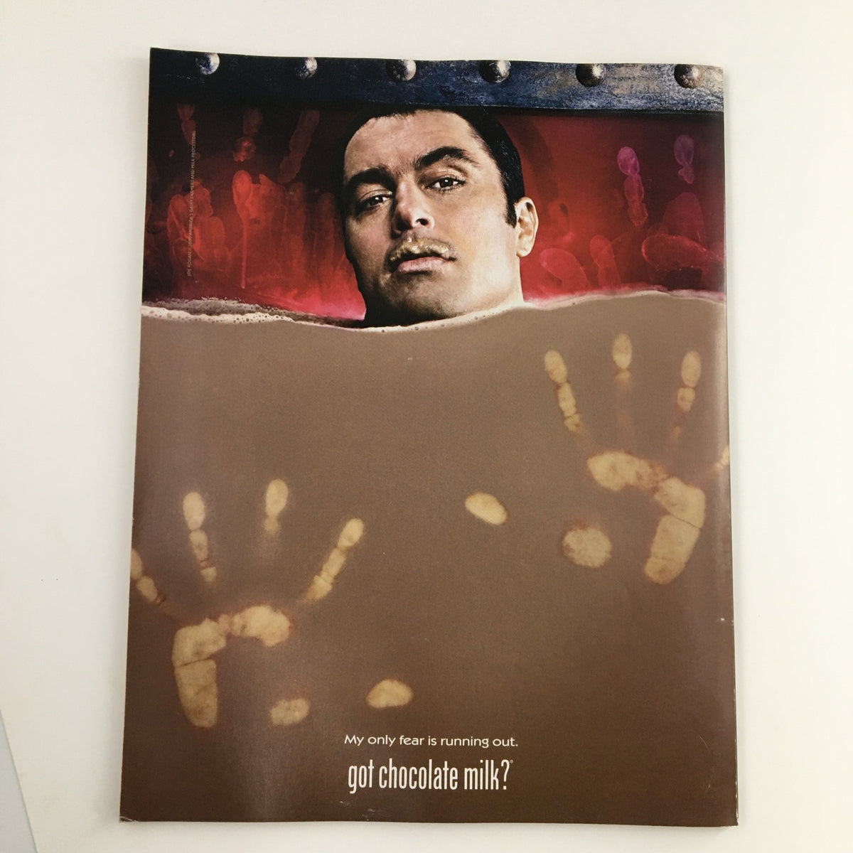 Page from Mad XL Magazine November 2002 #18 showing a humorous advertisement featuring a man in distress with the caption 'My only fear is running out. got chocolate milk?'