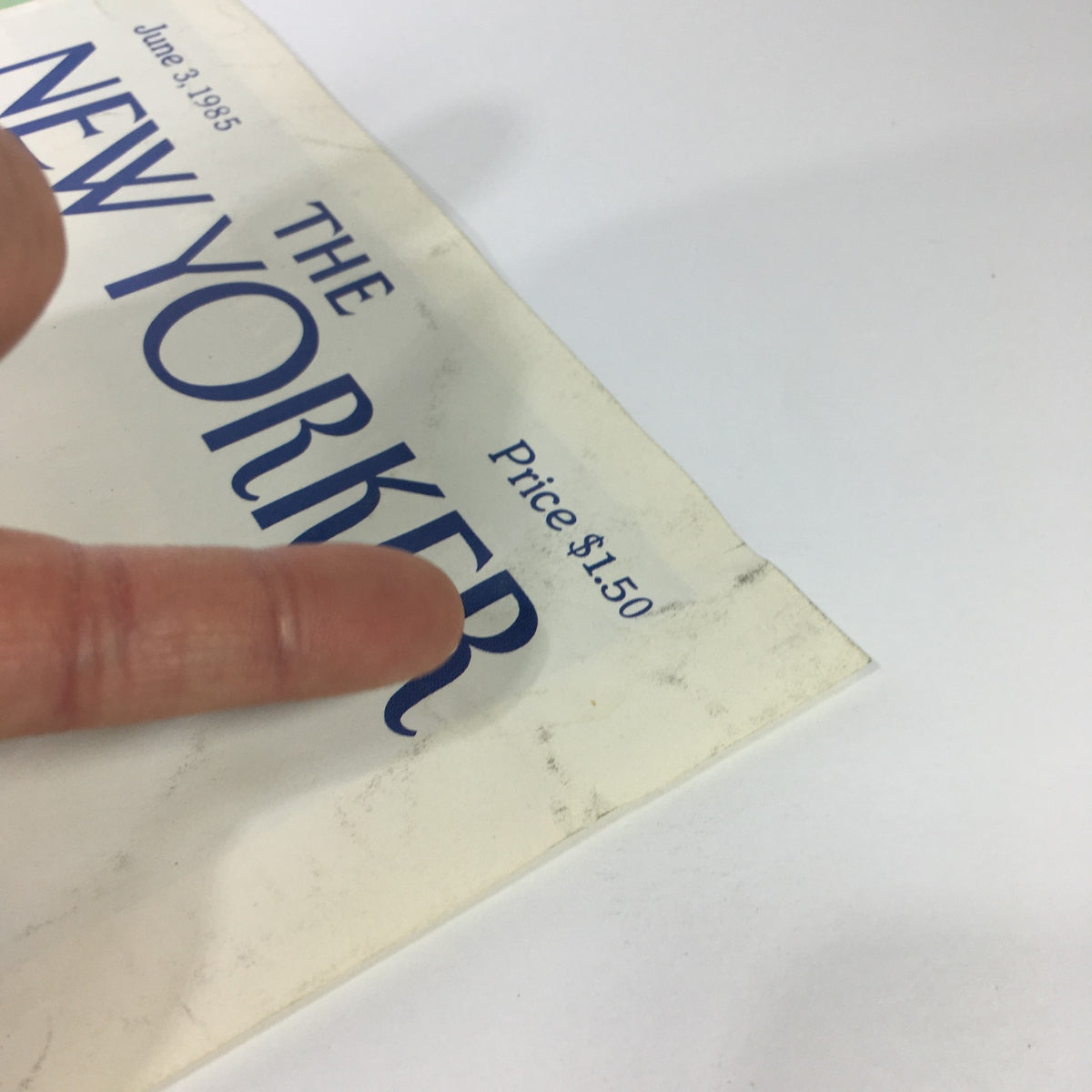 Detail of the price tag on The New Yorker Magazine June 3, 1985 cover, showcasing the publication's iconic logo.