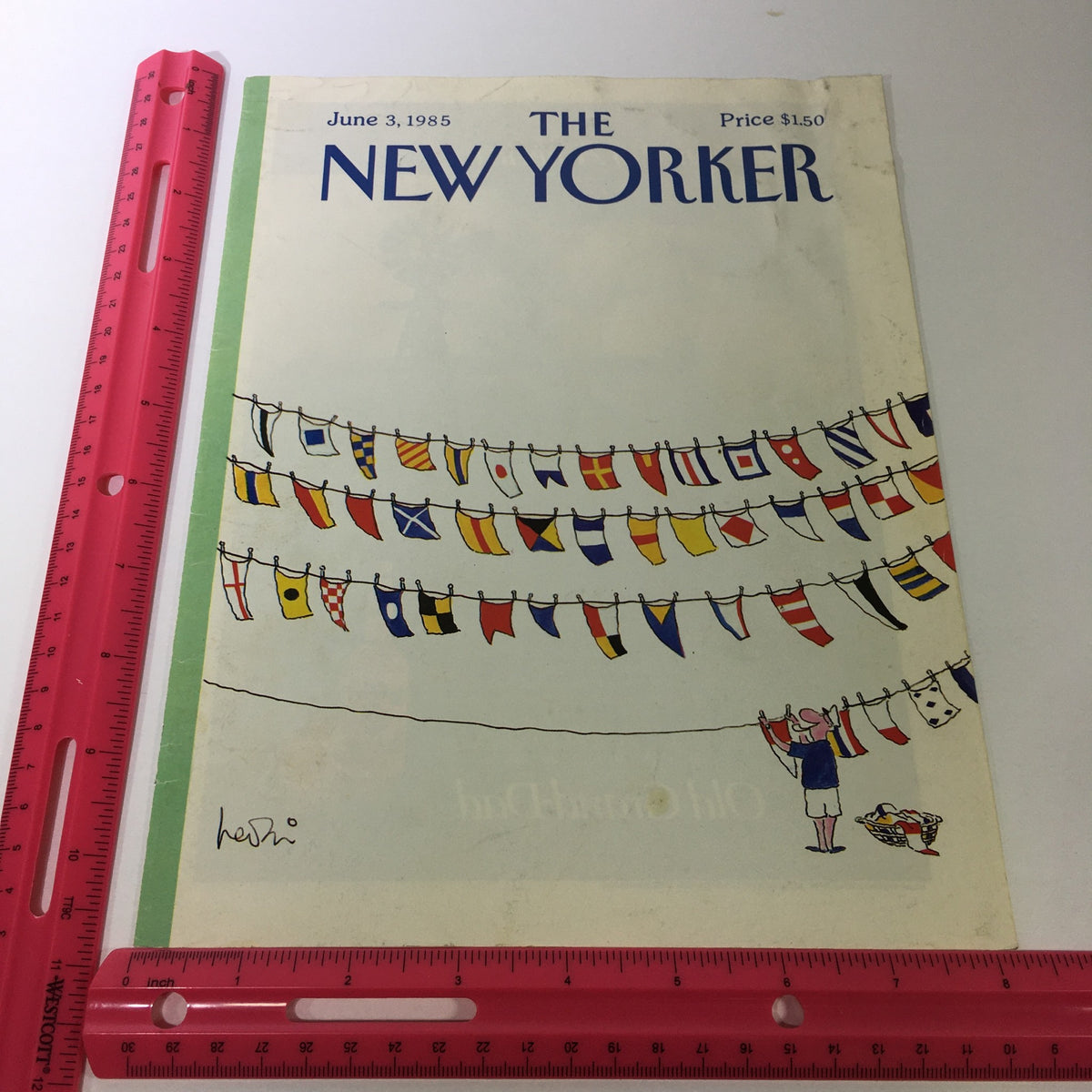 The New Yorker Magazine June 3, 1985 cover displayed with a ruler for scale, featuring an illustration of flags and a character.