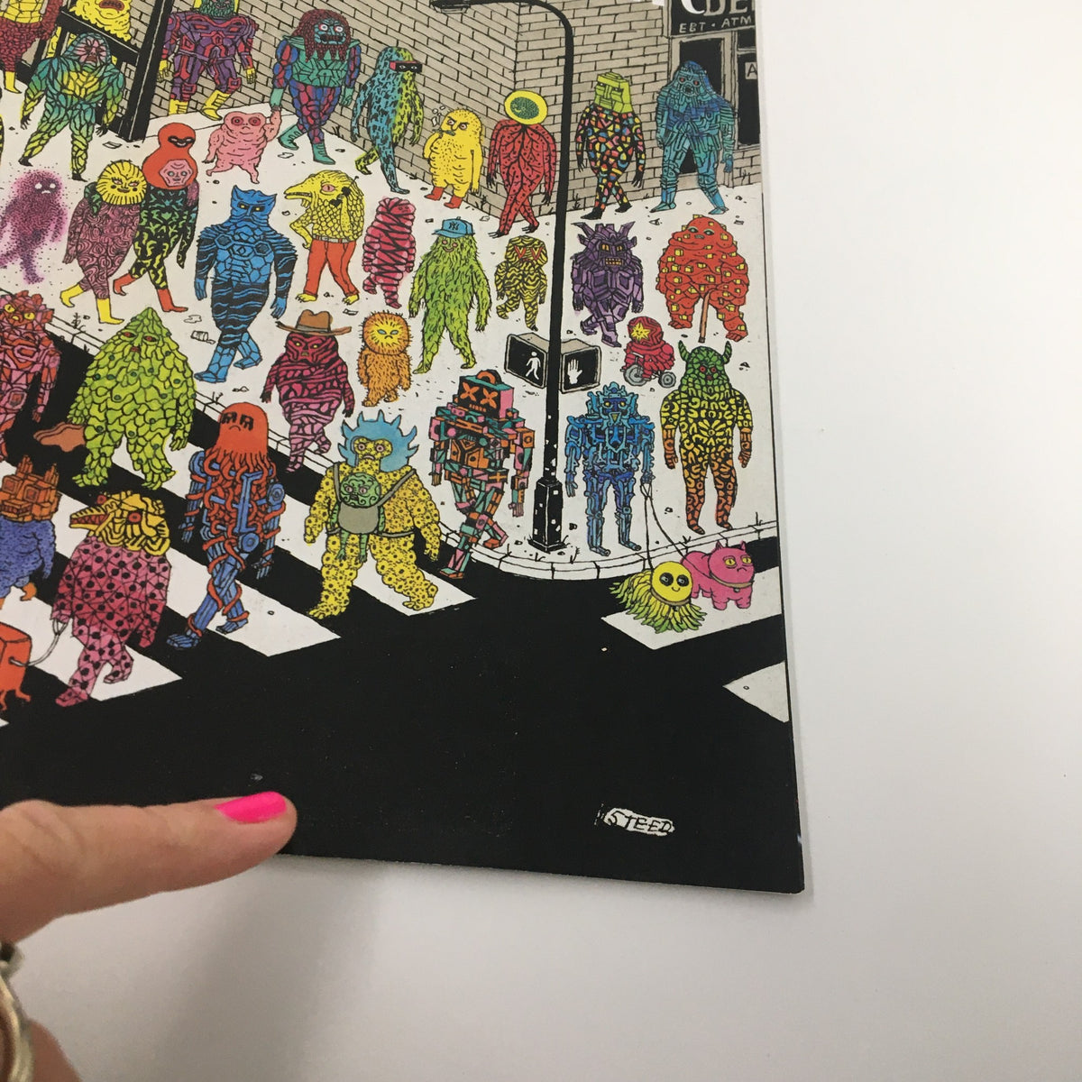Detail of the cover art from The New Yorker Full Magazine October 25, 2021, 'Beasts and Beauties' by Edward Steed, highlighting vibrant characters and whimsical designs at a city intersection.