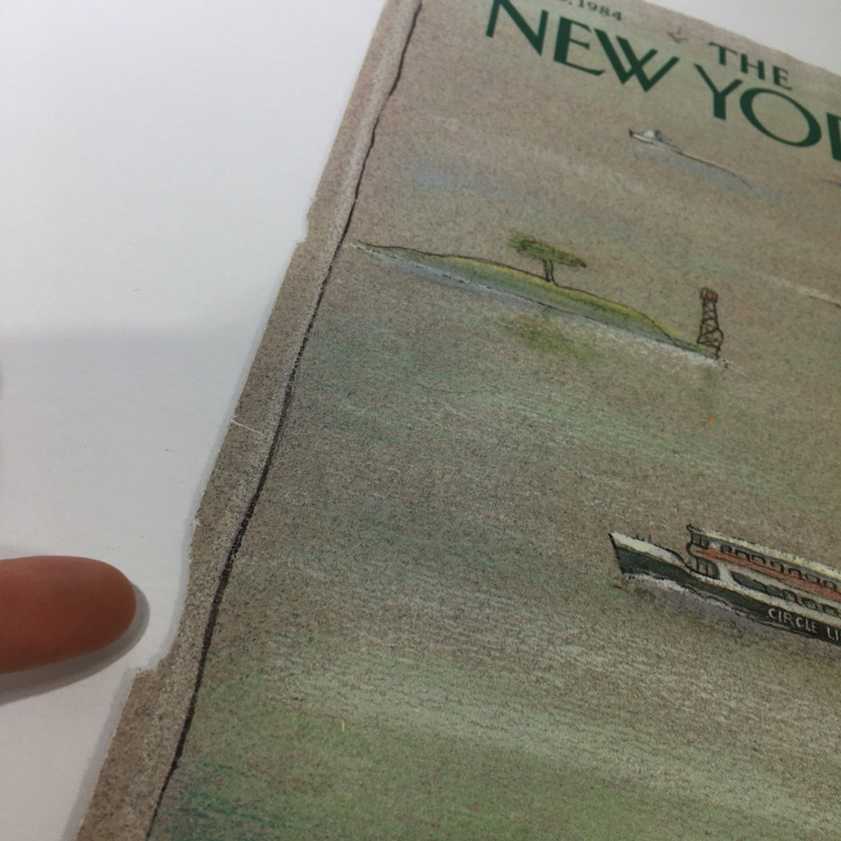Close-up of the edge of The New Yorker Magazine cover from August 6, 1984, showing vintage wear and the artwork by Eugene Mihaesco.