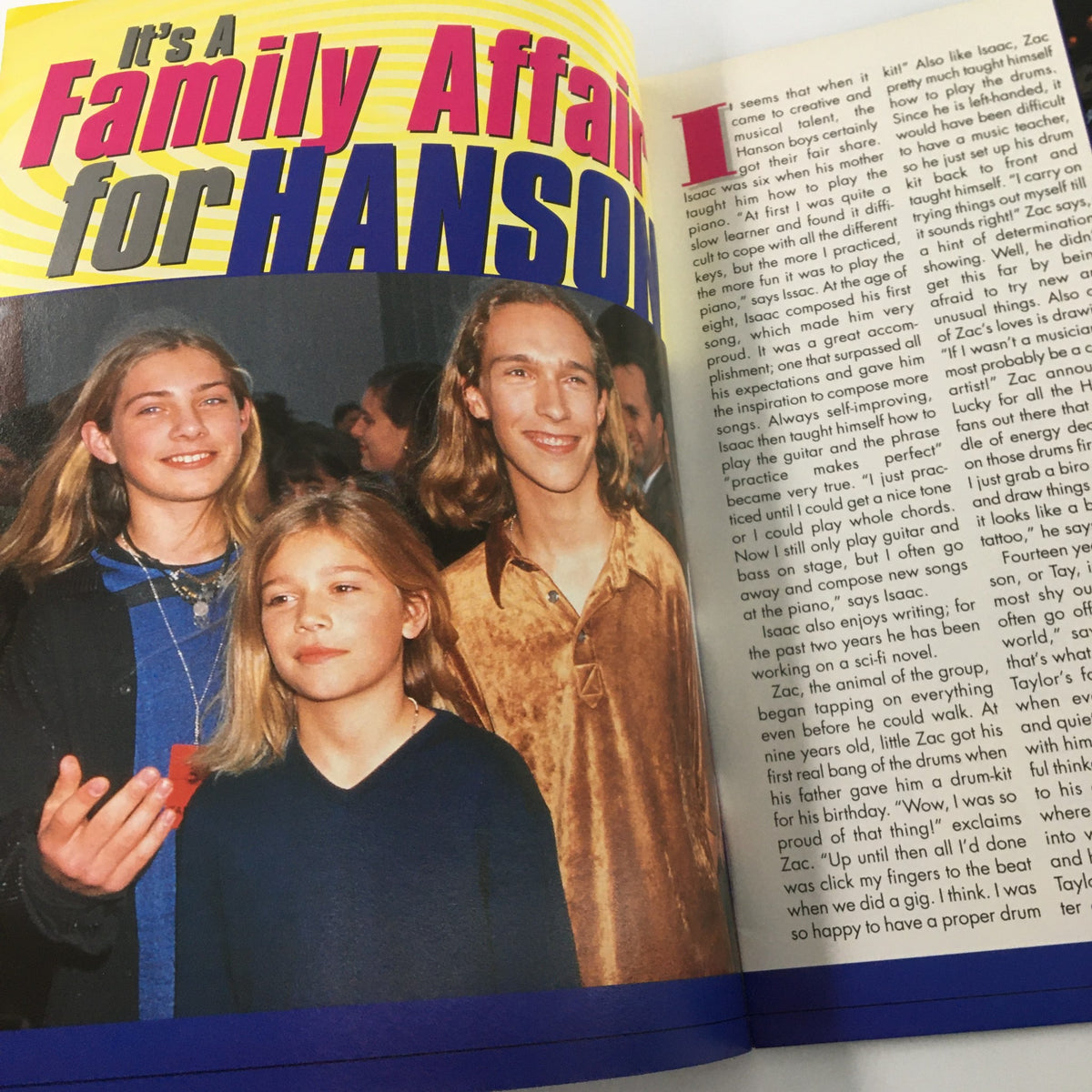 Hit Sensations Magazine 1998 article titled 'It's A Family Affair for HANSON', featuring Hanson band members in a candid photo.