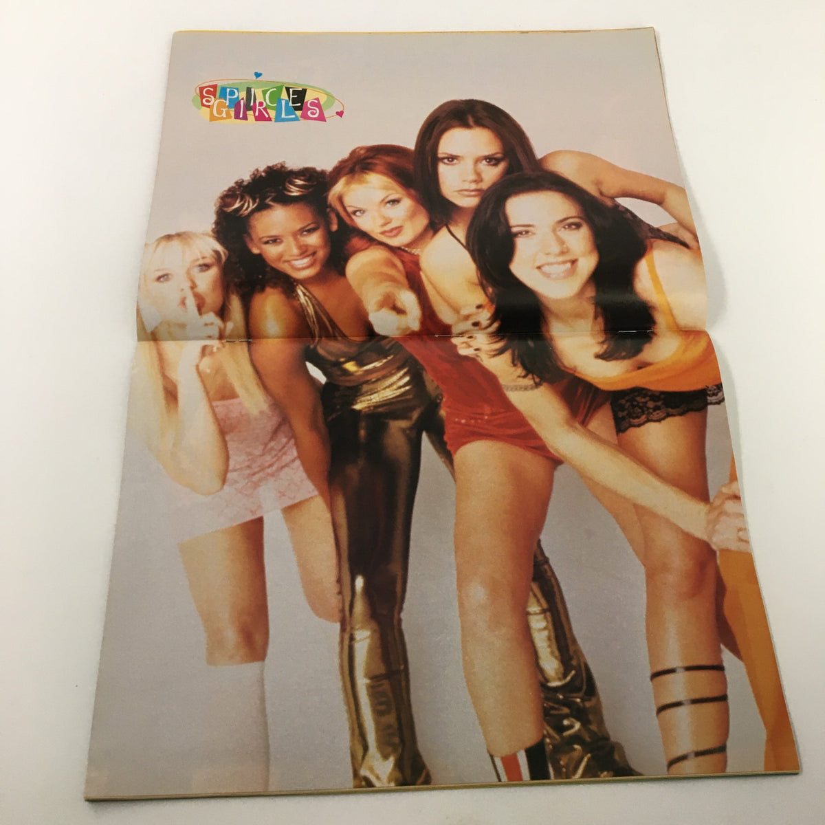 Promotional photo of the Spice Girls from Superteen Magazine August 1998, capturing their personalities and distinct fashion styles. Volume 21, Issue 6.
