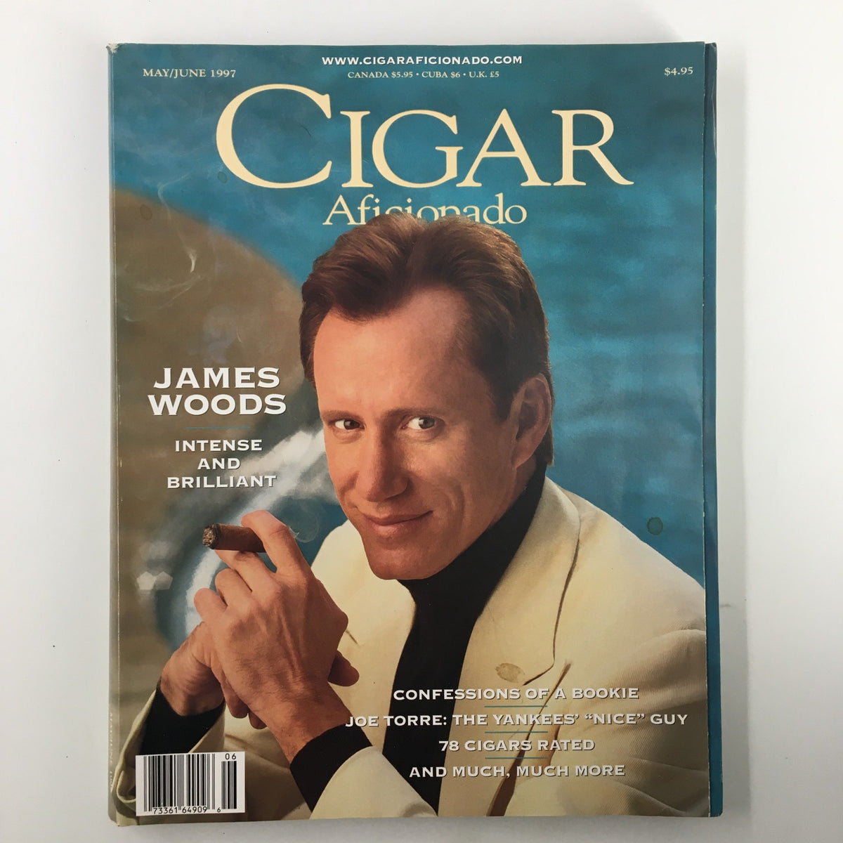 Cigar Aficionado Magazine May 1997 featuring James Woods on the cover, showcasing the theme 'Intense and Brilliant'. The magazine highlights cigar ratings and includes articles such as 'Confessions of a Bookie' and 'Joe Torre: The Yankees' Nice Guy'.