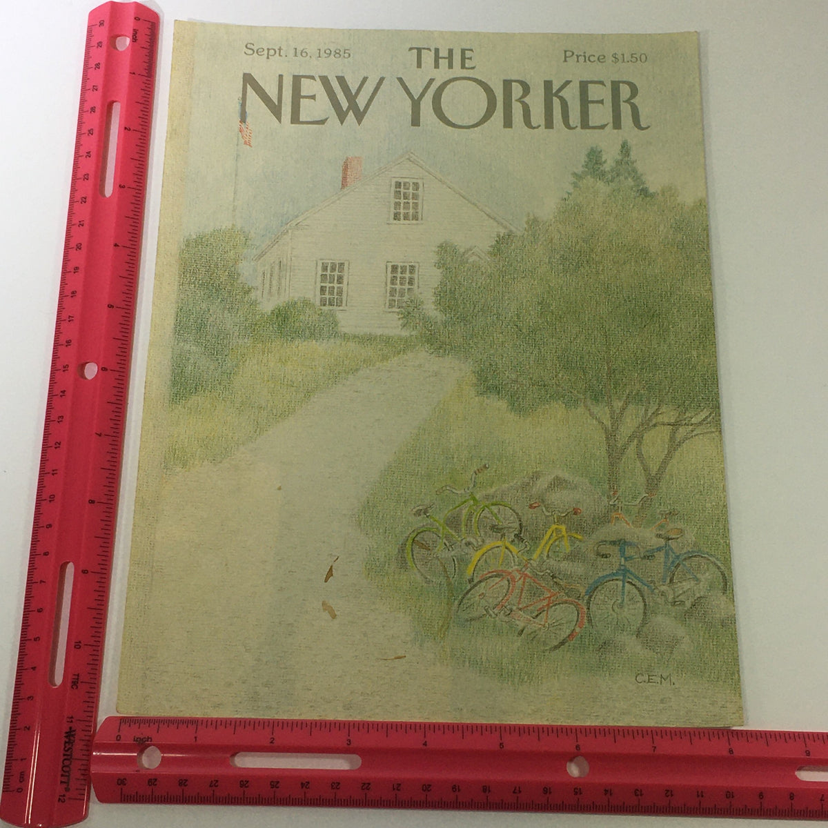 COVER ONLY - The New Yorker Magazine September 16 1985, displayed next to a ruler for scale, showcasing the artistic illustration by Charles E. Martin of a quaint house and bicycles.