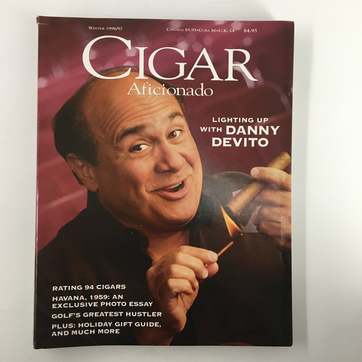 Cigar Afficionado Magazine Winter 1996 featuring Danny DeVito on the cover, showcasing the theme 'Lighting Up with Danny DeVito' and highlighting cigar culture.