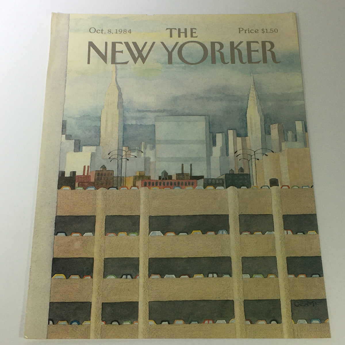 Cover of The New Yorker Magazine from October 8, 1984, showcasing artwork featuring the Empire State Building and a parking garage depiction, designed by Charles E. Martin.