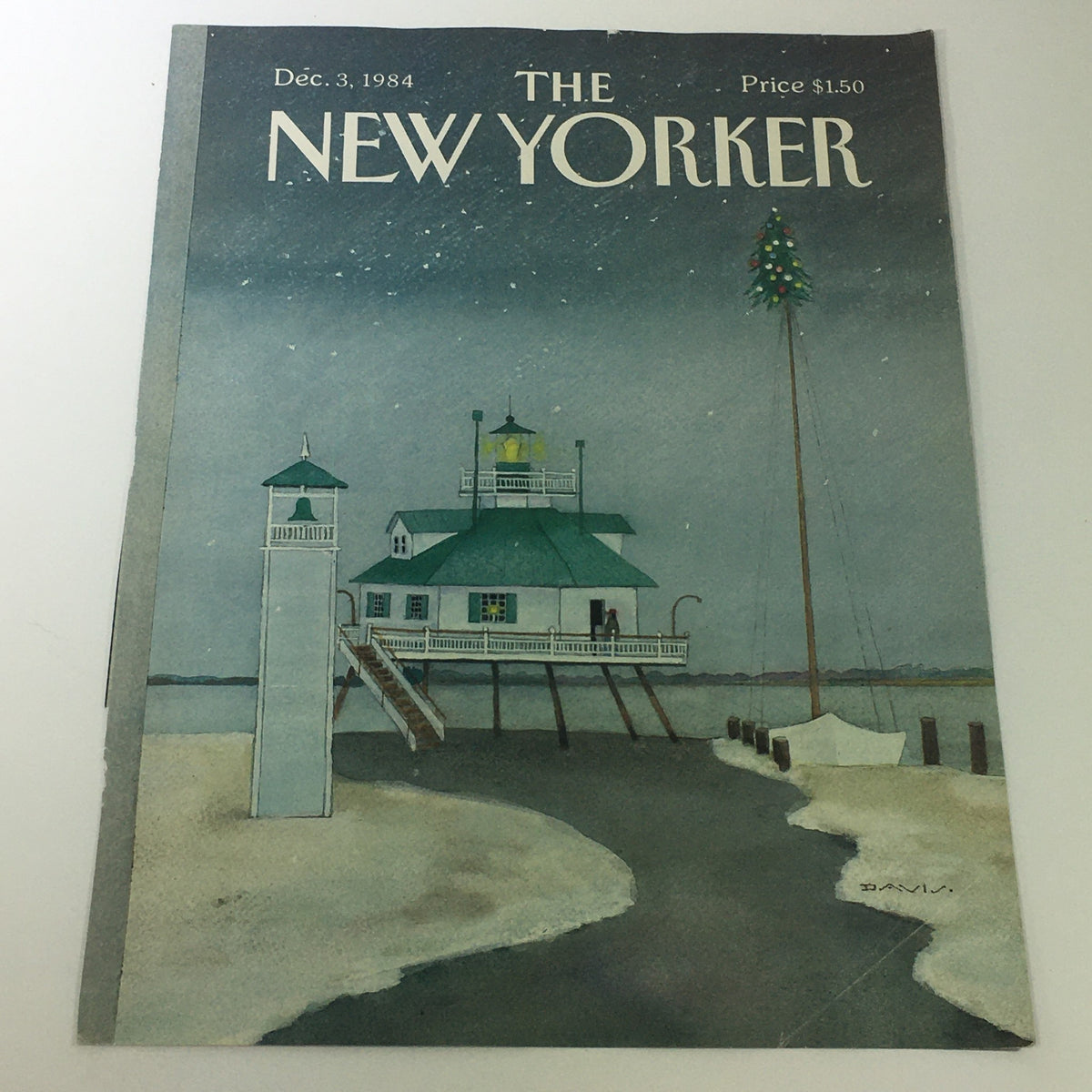 Cover of The New Yorker Magazine dated December 3, 1984, featuring a watercolor illustration by Susan Davis of a coastal scene with a lighthouse and stylized structures, reflecting the artistic style of the era.