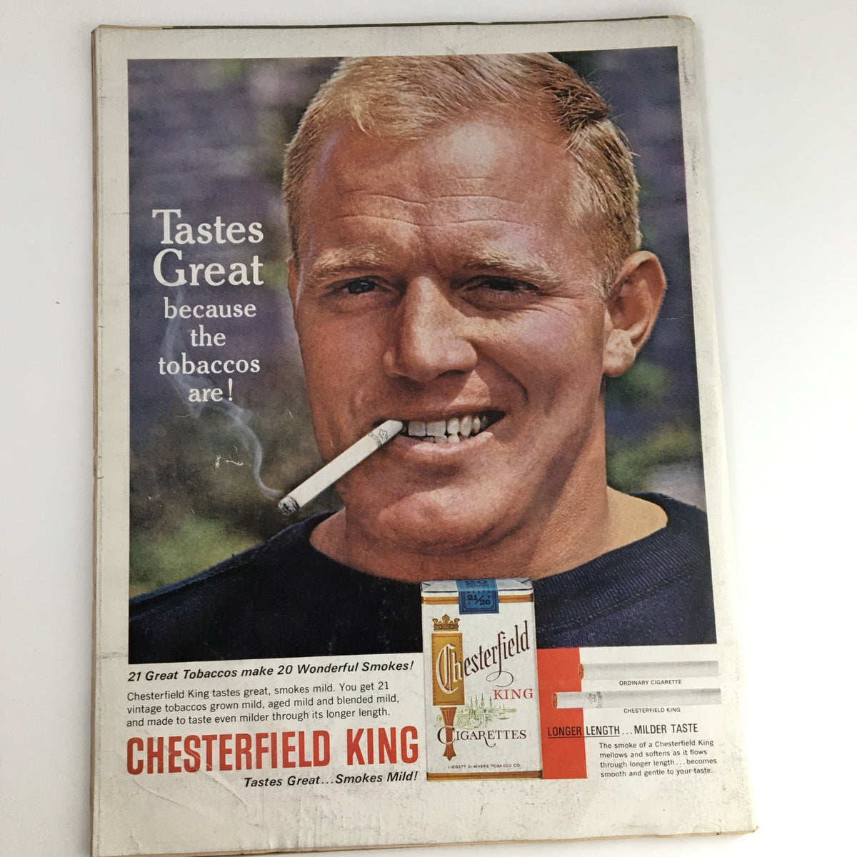 Chesterfield King cigarette advertisement featuring a smiling man with blonde hair, holding a cigarette. The ad promotes the flavor of the tobacco with the tagline 'Tastes Great because the tobaccos are!' This image is part of the Life Magazine May 17 1963 issue showcasing Governor Nelson Rockefeller and Happy Rockefeller.