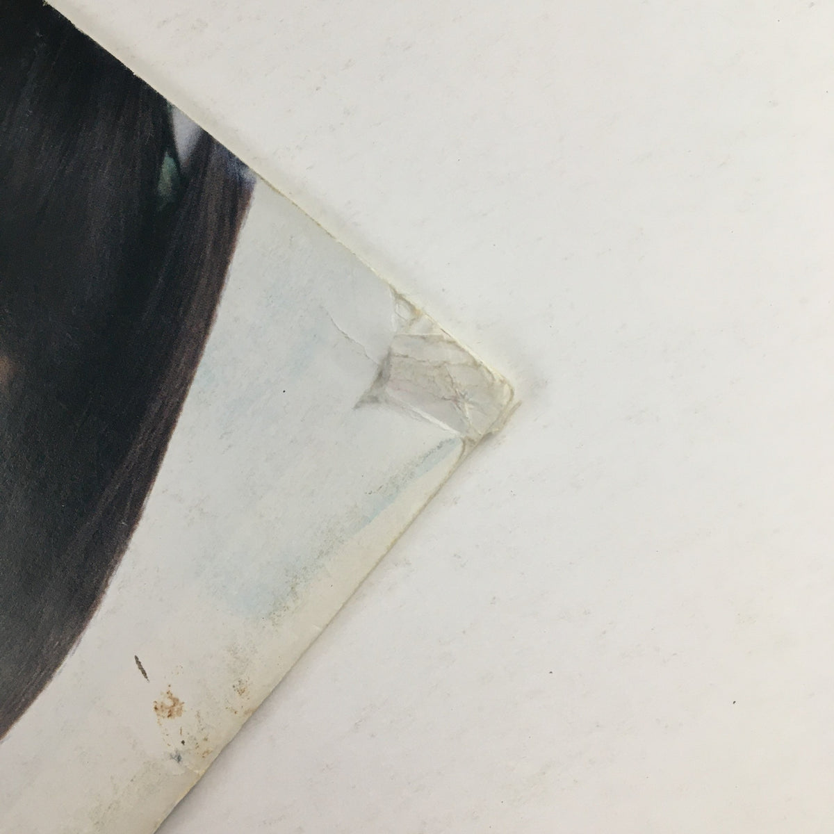 Close-up of the edge of the back cover of American Girl Magazine March 1995, showing minor wear typical of vintage publications.
