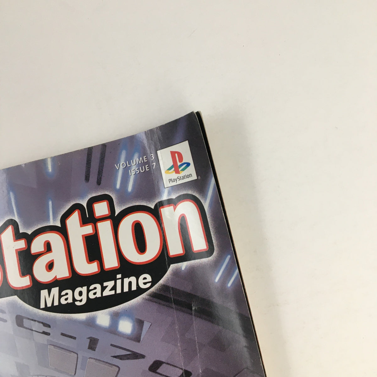 Close-up view of PlayStation Magazine April 2000 showing the publication volume and issue number with a PlayStation logo.