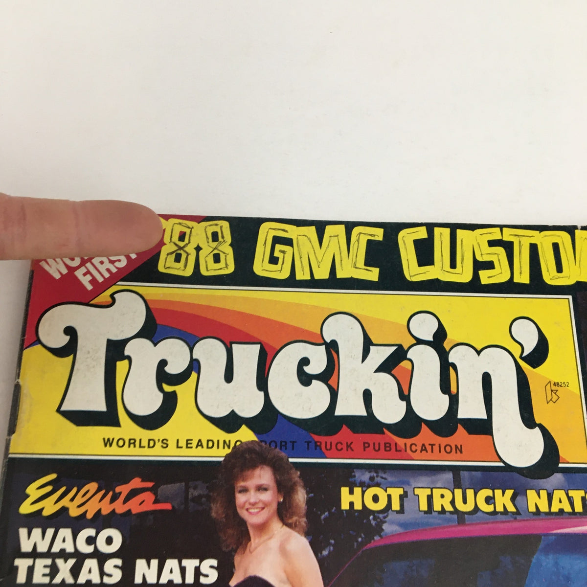 Close-up of the Truckin' Magazine February 1989 title, highlighting '88 GMC Custom' and elements of the cover design, including the magazine's vibrant colors and logo.