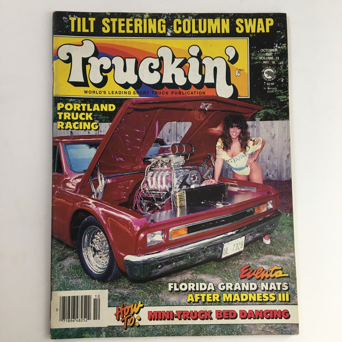 Cover of Truckin' Magazine October 1987, featuring Portland Truck Racing and a tilt steering column swap, with a vintage red truck and a model next to the open hood showcasing the engine.