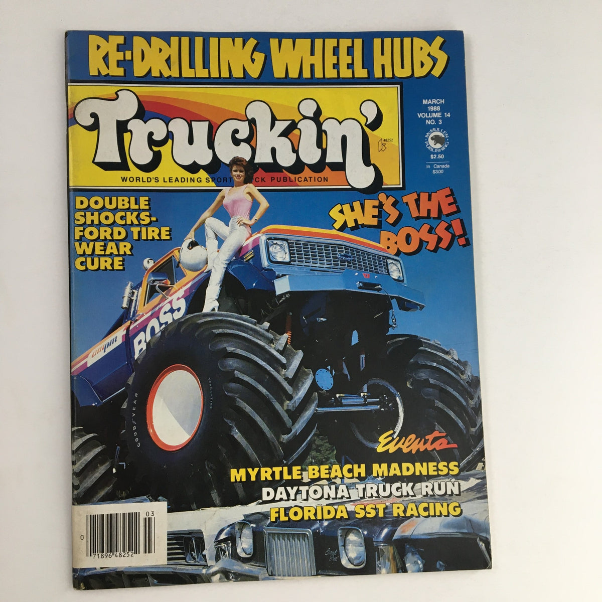 Cover of Truckin' Magazine March 1988 featuring double shocks and Ford tire wear cure, showcasing a woman in a pink top posing on a monster truck, with vibrant colors and bold text.