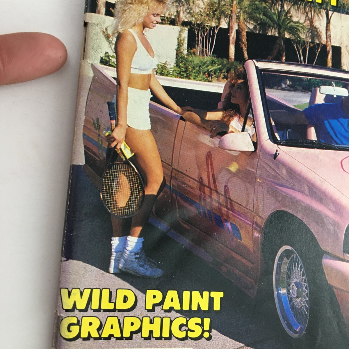 Close-up of the Truckin' Magazine April 1989 cover highlighting the 'Wild Paint Graphics!' feature and models next to a customized pink truck.