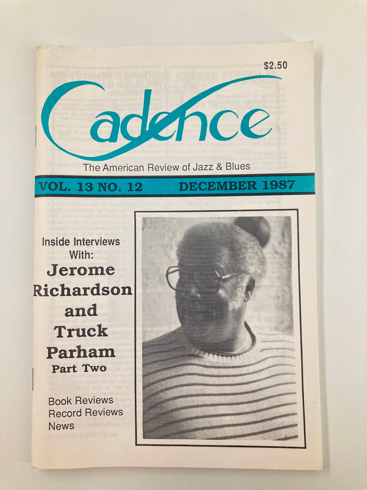 Cover of VTG Cadence Jazz Magazine December 1987 Vol 13 #2 featuring Jerome Richardson and Truck Parham, showcasing a black-and-white image of a smiling man wearing glasses and a striped sweater.