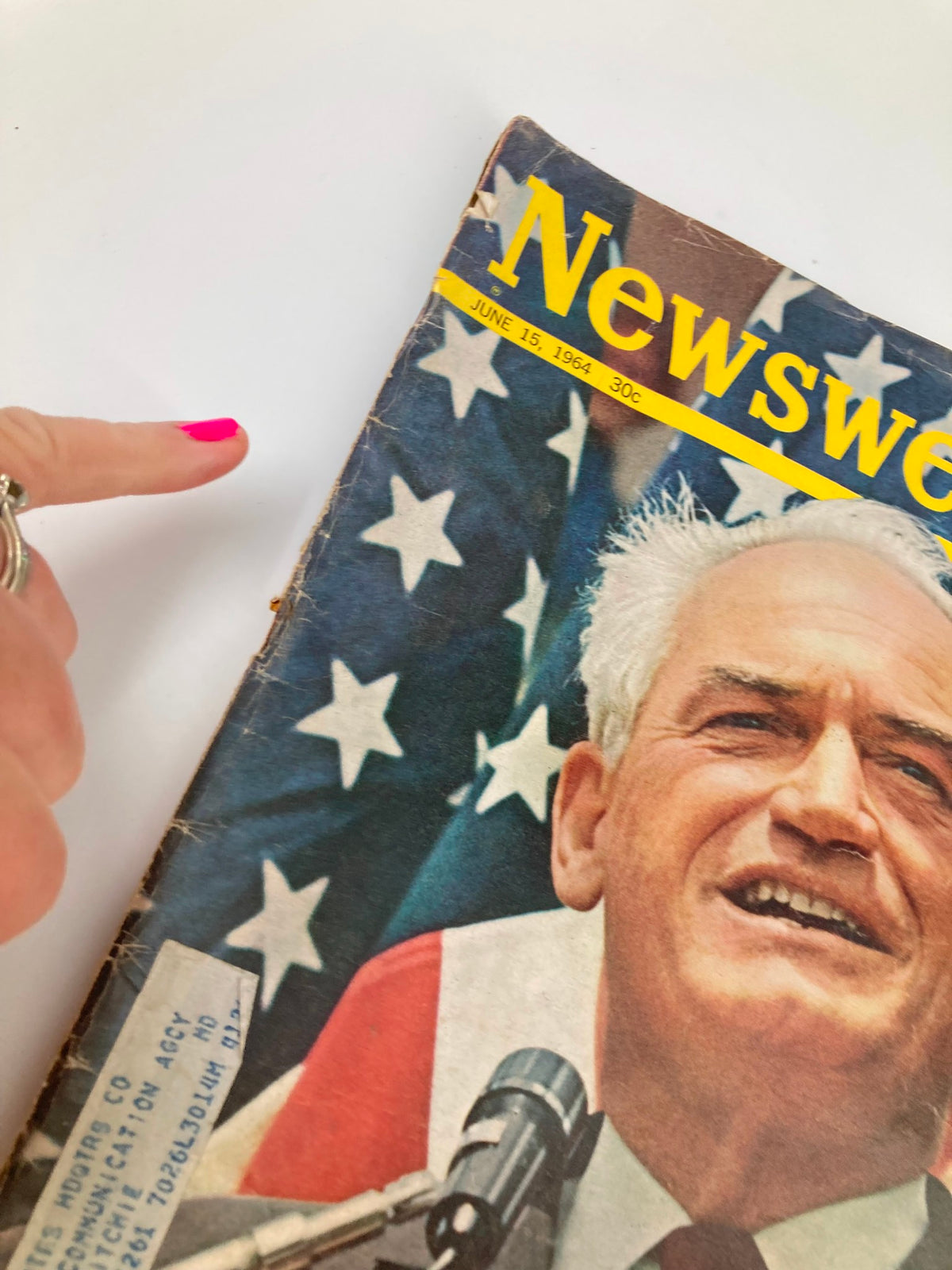 Close-up view of the cover of VTG Newsweek Magazine dated June 15, 1964, highlighting the headline 'Can Goldwater Be Stopped?' and a hand pointing at the magazine.