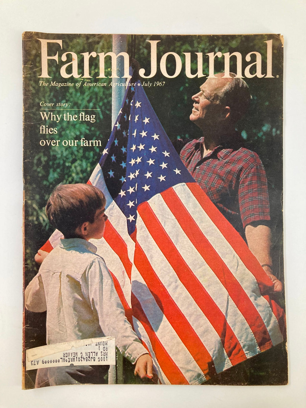 Cover of VTG Farm Journal Magazine July 1967 featuring the title 'Why The Flag Flies Over Our Farm'. The cover shows a man and a boy holding a large American flag, symbolizing patriotism and rural life.