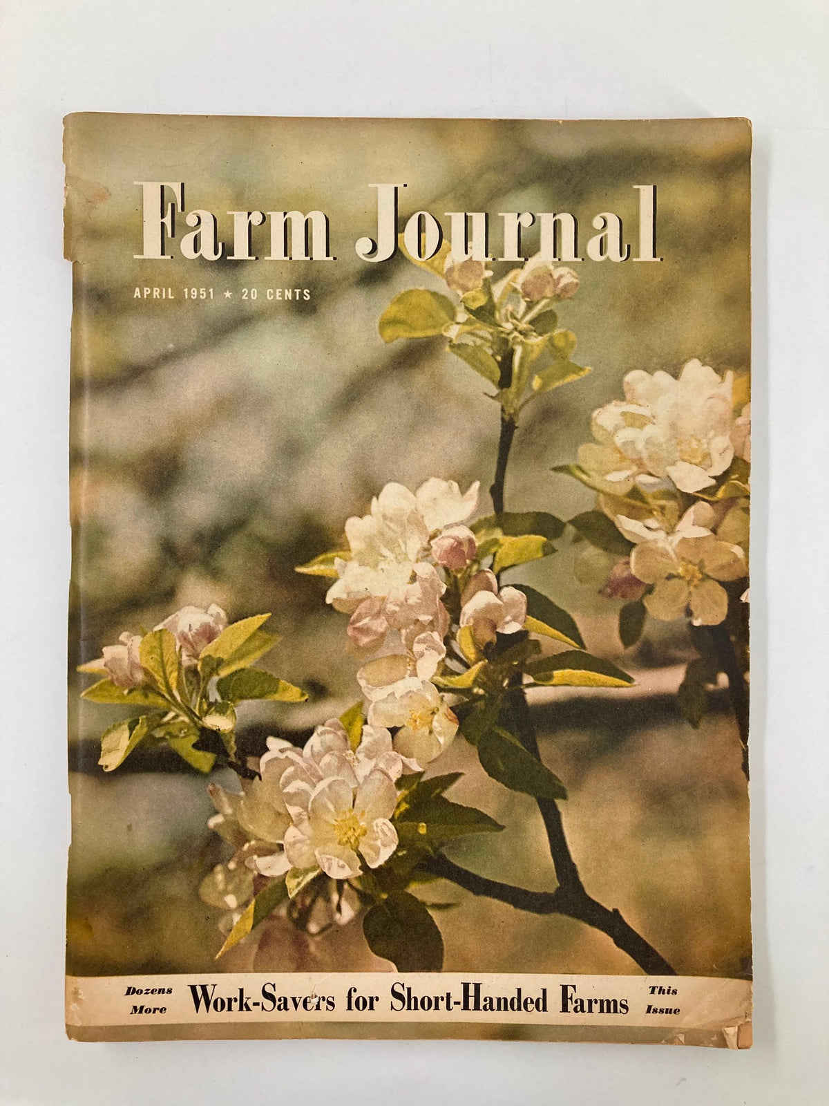 Cover of the VTG Farm Journal Magazine from April 1951 featuring blooming flowers and the title 'Farm Journal', highlighting an issue focused on innovative farming practices and natural pest control.