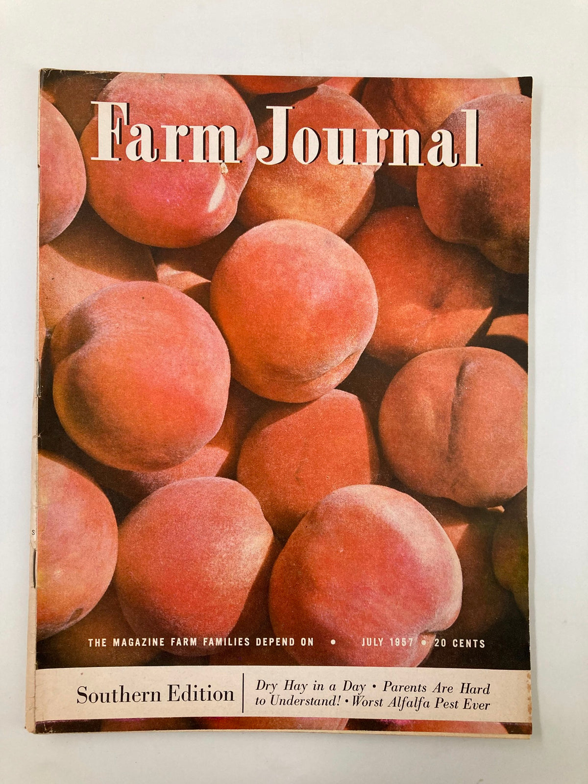 Cover of VTG Farm Journal Magazine July 1957 featuring fresh tree-ripened peaches, reflecting the essence of rural life and nostalgic summer days.
