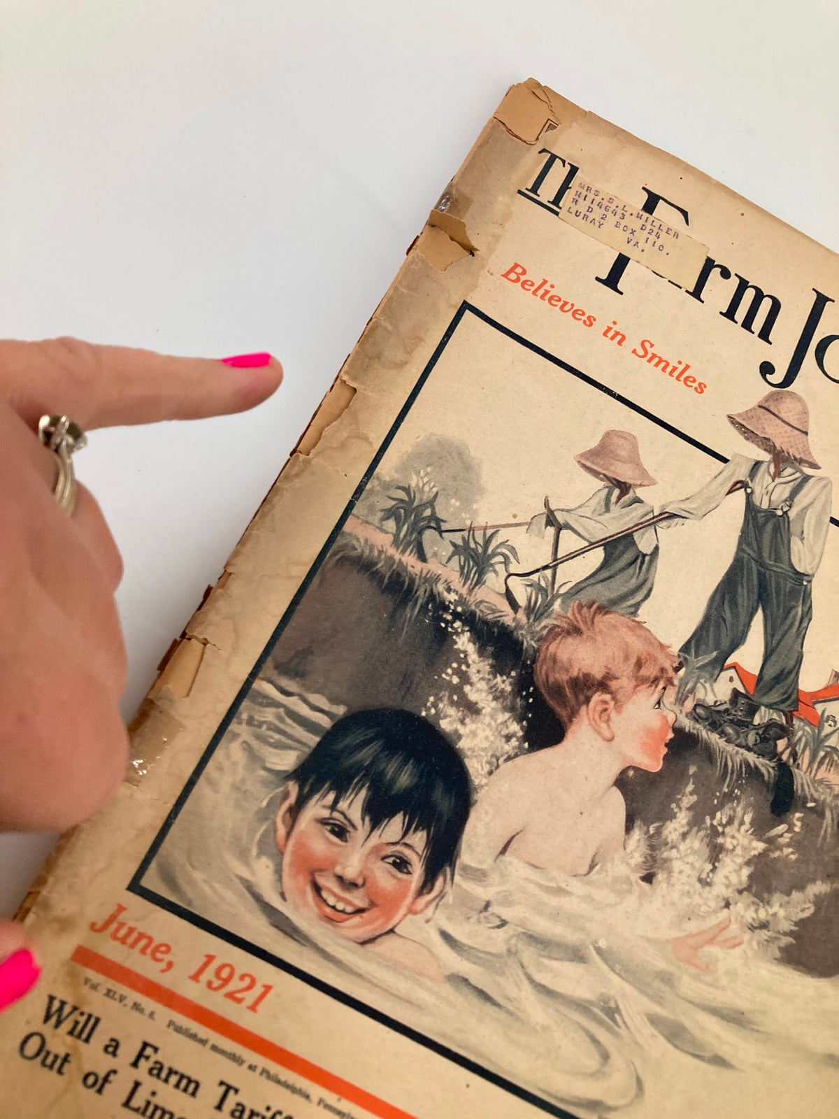Close-up of the cover of VTG The Farm Journal Magazine June 1921, highlighting a boy's face in a pool and farm workers, with the title 'Will a Farm Tariff Bring a World War?'.