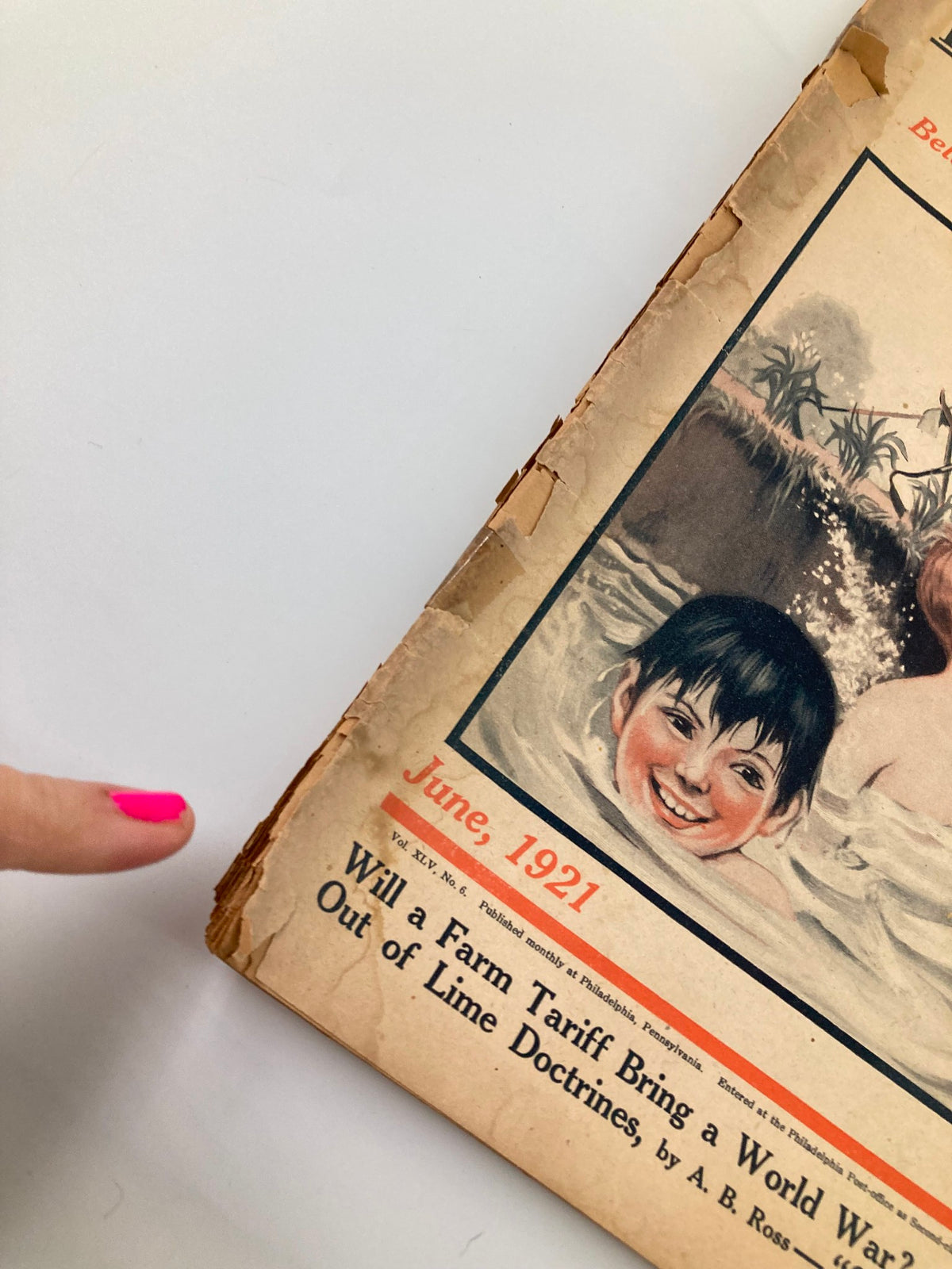 Detailed view of VTG The Farm Journal Magazine June 1921 cover showing a boy in water, with an emphasis on the title 'Will a Farm Tariff Bring a World War?'.