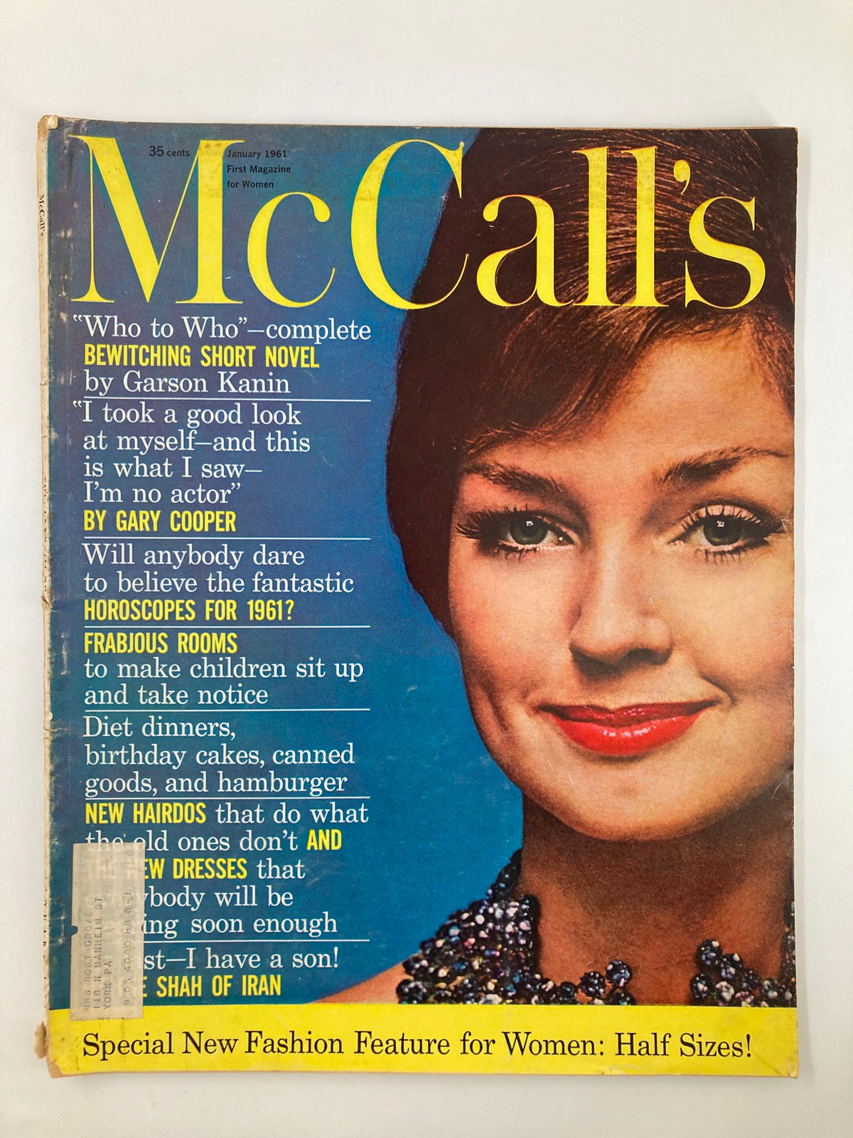 Cover of VTG McCall's Magazine January 1961 titled 'The Wonderful World of Little Fishes', showcasing a model with striking makeup and wearing a beaded necklace, colorful text highlighting features inside the issue.