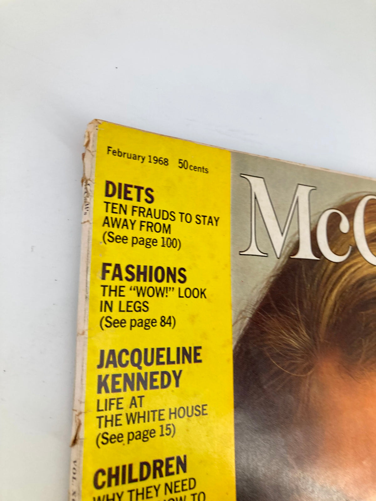 Close-up of the vintage McCall's Magazine cover from February 1968, showcasing the title and articles, including a feature on Jacqueline Kennedy and her life in the White House.